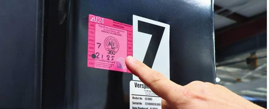 Serialized ALI inspection sticker applied to a lift column